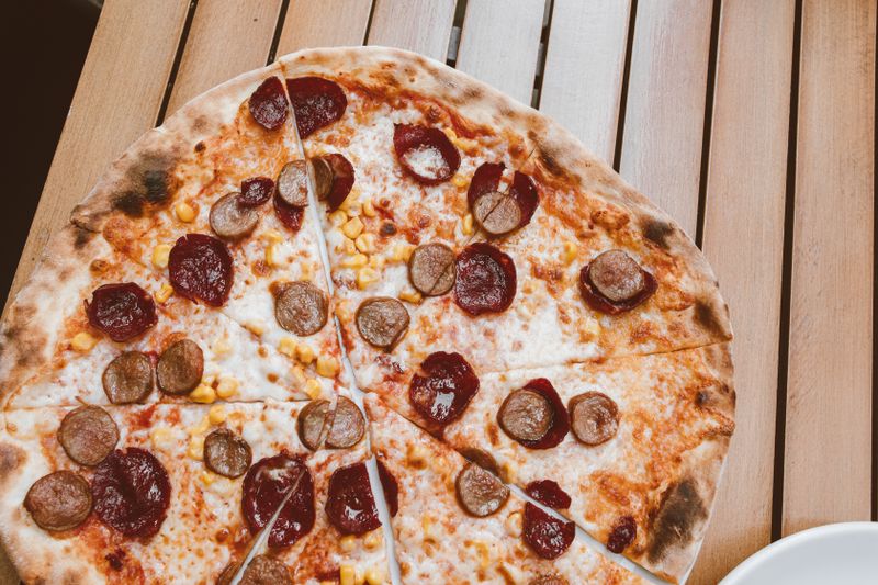 Supreme Deep Dish pizza with pepperoni and vegetables giordanos